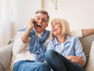 Excited senior man talking on phone Excited senior man talking on phone